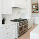 ZLINE Ducted Wall Mount Range Hood Insert in Stainless Steel (695) in a custom range hood above double oven range