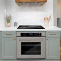 ZLINE Wall Oven built-in to cabinets beneath ZLINE Induction Cooktop in a cozy beach-style kitchen.