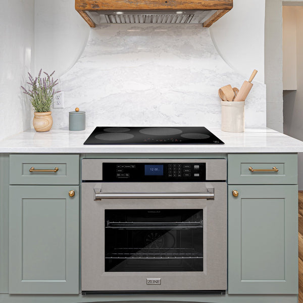 ZLINE Wall Oven built-in to cabinets beneath ZLINE Induction Cooktop in a cozy beach-style kitchen.