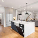 ZLINE 24 in. Monument Dishwasher with Oil-Rubbed Bronze Door (DWMT-ORB-24) in farmhouse style kitchen with white counters