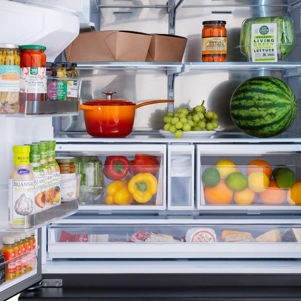 Food on adjustable shelving inside ZLINE Autograph Edition 36 in. 28.9 cu. ft. Standard-Depth French Door External Water Dispenser Refrigerator with Dual Ice Maker in Black Stainless Steel and Champagne Bronze Handles (RSMZ-W-36-BS-CB)