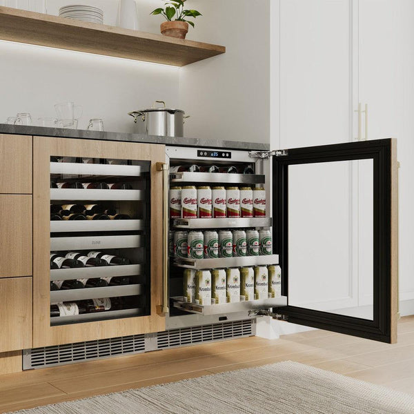 ZLINE Autograph Edition 24 in. Touchstone Dual Zone 44 Bottle Wine Cooler With Panel Ready Glass Door And Champagne Bronze Handle (RWDPOZ-24-CB) in a custom home bar area from side, with beverages on extended adjustable shelves.
