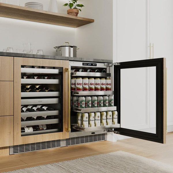 ZLINE Autograph Edition 24 in. Touchstone 151 Can Beverage Fridge With Panel Ready Glass Door And Polished Gold Handle (RBSPOZ-24-G) in a custom home bar area from side, with beverages on extended adjustable shelves.
