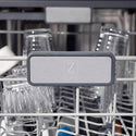 ZLINE 24 in. Monument Series 3rd Rack Top Touch Control Dishwasher with Fingerprint Resistant Stainless Steel Panel, 45dBa (DWMT-SN-24) close-up, ZLINE logo on dish rack.