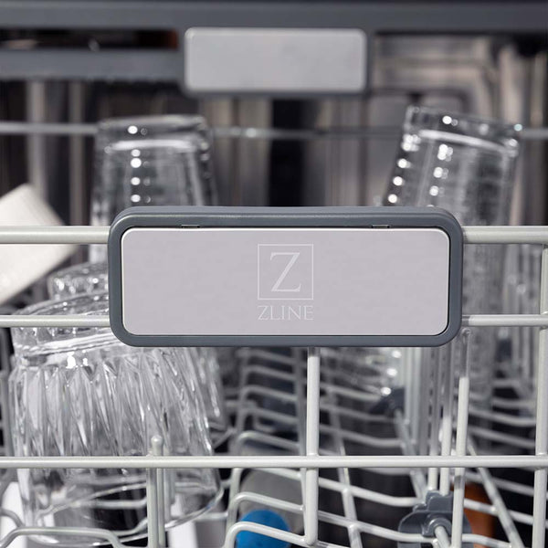 ZLINE Autograph Edition 24 in. 3rd Rack Top Touch Control Tall Tub Dishwasher in Stainless Steel with Polished Gold Handle, 45dBa (DWMTZ-304-24-G) close-up, ZLINE logo on dish rack.