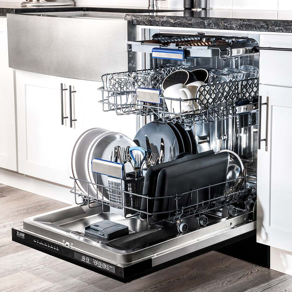 ZLINE 24 in. Tallac Series 3rd Rack Dishwasher with Black Matte Panel and Traditional Handle, 51dBa (DWV-BLM-24) in a luxury kitchen from side, open with dishes loaded on all dish racks.