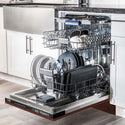 ZLINE 24" Tallac Series 3rd Rack Dishwasher with Hand-Hammered Copper Panel and Traditional Handle, 51dBa (DWV-HH-24) in a luxury kitchen from side, open with dishes loaded on all dish racks.