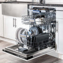 ZLINE 24" Tallac Series 3rd Rack Dishwasher with White Matte Panel and Traditional Handle, 51dBa (DWV-WM-24) in a luxury kitchen from side, open with dishes loaded on all dish racks.
