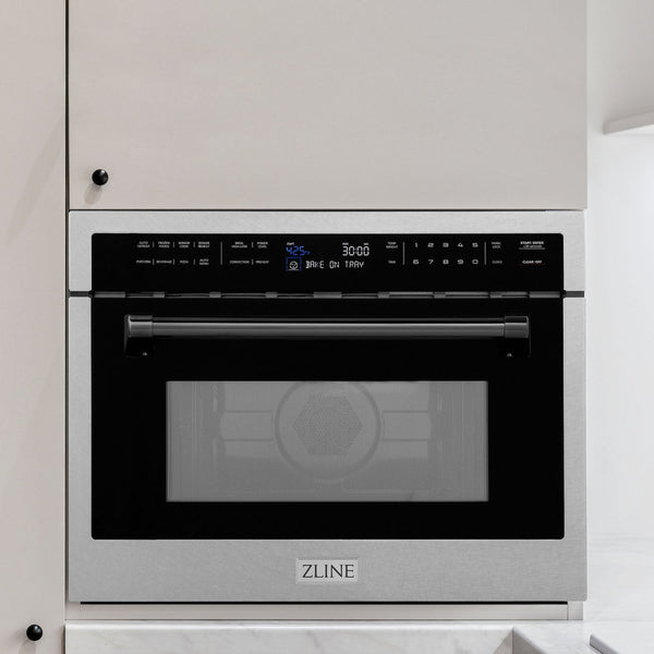 ZLINE Autograph Edition 24 in. 1.6 cu ft. Built-in Convection Microwave Oven in DuraSnow Stainless Steel with Matte Black Accents built-in to white kitchen wall.
