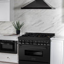 ZLINE 36 in. 4.6 cu. ft. Dual Fuel Range with Gas Stove and Electric Oven in Black Stainless Steel with Brass Burners (RAB-BR-36) in a luxury cottage-style kitchen with matching microwave and range hood.