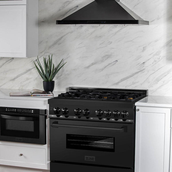 ZLINE 36 in. 4.6 cu. ft. Dual Fuel Range with Gas Stove and Electric Oven in Black Stainless Steel with Brass Burners (RAB-BR-36) in a luxury cottage-style kitchen with matching microwave and range hood.