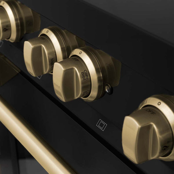 Champagne Bronze range knobs and handle on black stainless steel.