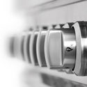 Stainless steel cooktop and oven control knobs.
