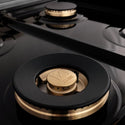 ZLINE brass burners and black porcelain cooktop close up.