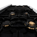 ZLINE brass burners, cast iron grates, and griddle on black porcelain cooktop.
