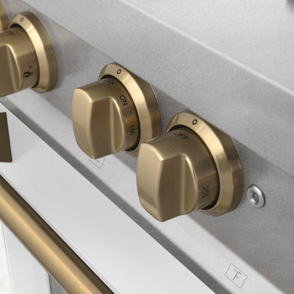 ZLINE Autograph Edition 36 in. 4.6 cu. ft. Dual Fuel Range with Gas Stove and Electric Oven in DuraSnow® Stainless Steel with White Matte Door and Champagne Bronze Accents (RASZ-WM-36-CB) close-up, Champagne Bronze knobs.