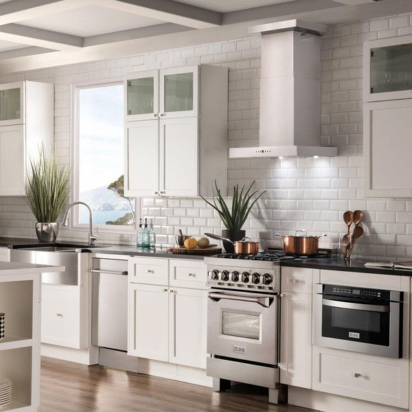 ZLINE Convertible Vent Wall Mount Range Hood in Stainless Steel with Crown Molding (KECRN) in a luxury cottage-style kitchen.