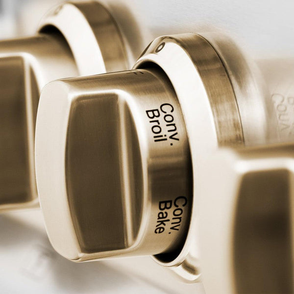Polished Gold oven and cooktop knobs on ZLINE Autograph Edition Range.