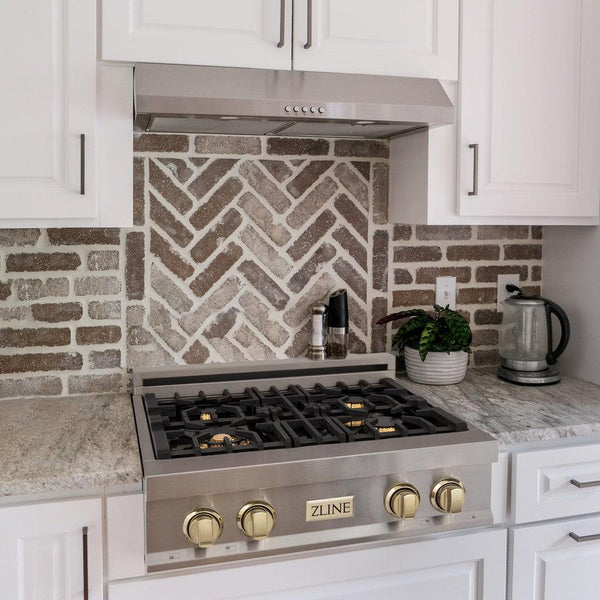 ZLINE Autograph Edition 30 in. Porcelain Rangetop with 4 Gas Burners in Stainless Steel and Polished Gold Accents (RTZ-30-G) lifestyle, in a luxury kitchen.