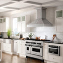 ZLINE Autograph Edition 48 in. 6.0 cu. ft. Dual Fuel Range with Gas Stove and Electric Oven in DuraSnow® Stainless Steel with Matte Black Accents (RASZ-SN-48-MB) lifestyle image from side in a luxury farmhouse-style kitchen with white cabinetry.