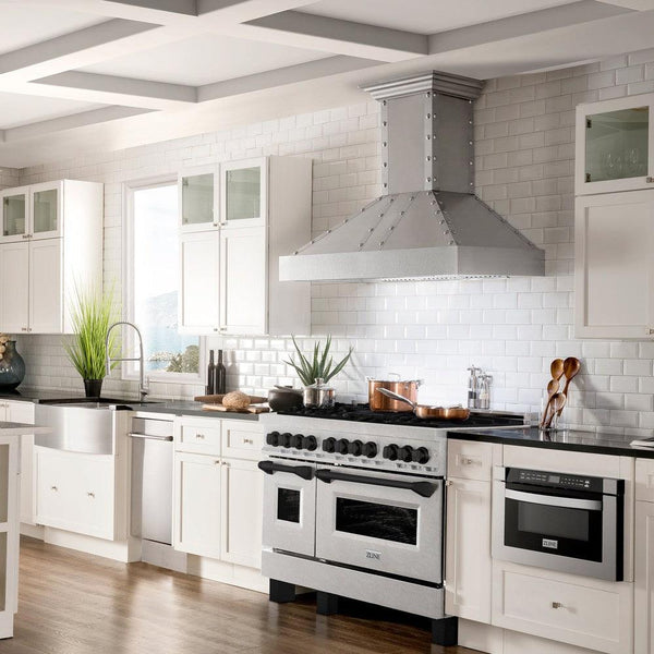 ZLINE Autograph Edition 48 in. 6.0 cu. ft. Dual Fuel Range with Gas Stove and Electric Oven in DuraSnow® Stainless Steel with Matte Black Accents (RASZ-SN-48-MB) lifestyle image from side in a luxury farmhouse-style kitchen with white cabinetry.