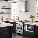 ZLINE Ducted Vent Wall Mount Range Hood in Stainless Steel with Built-in ZLINE CrownSound Bluetooth Speakers (KN4CRN-BT) in a luxury farmhouse-style kitchen from side.