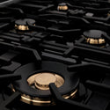 Six brass burners and cast iron grates on ZLINE Autograph Edition 36 in. Dual Fuel Range with White Matte Door and Polished Gold Accents (RAZ-WM-36-G)