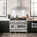ZLINE Convertible Vent Wall Mount Range Hood in Stainless Steel (KL2) above a double oven range in a luxury apartment kitchen.