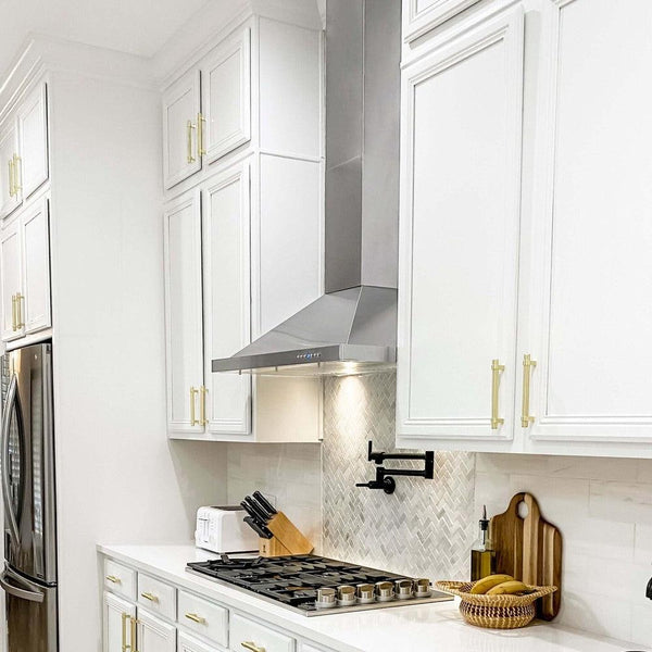 ZLINE Convertible Vent Outdoor Approved Wall Mount Range Hood in Stainless Steel (KB-304) in a luxury kitchen from side.