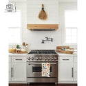 ZLINE Ducted Wall Mount Range Hood Insert in Outdoor Approved Stainless Steel (721-304) in a custom white range hood.