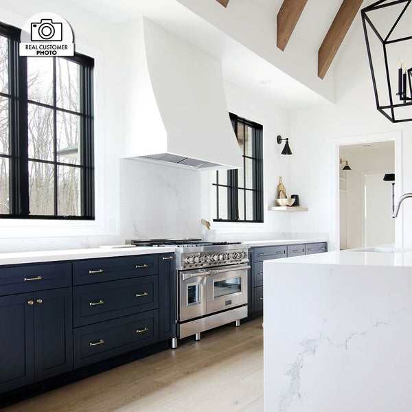 ZLINE Ducted Wall Mount Range Hood Insert in Outdoor Approved Stainless Steel (721-304) in a custom range hood in a luxury kitchen.