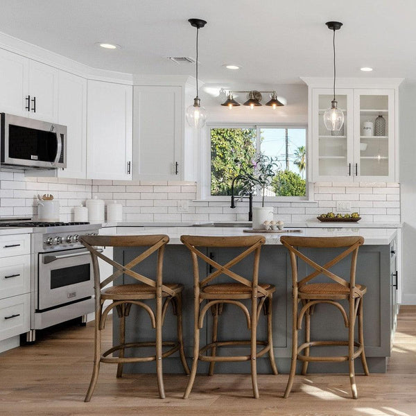 ZLINE Stainless Steel Over the Range Convection Microwave Oven with Modern Handle (MWO-OTR-30) in a rustic kitchen over a range