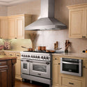 ZLINE Professional Convertible Vent Wall Mount Range Hood in Stainless Steel with Crown Molding (597CRN) in a farmhouse-style kitchen, side.
