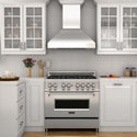ZLINE Professional Convertible Vent Wall Mount Range Hood in Stainless Steel with Crown Molding (597CRN) in a cottage-style kitchen.